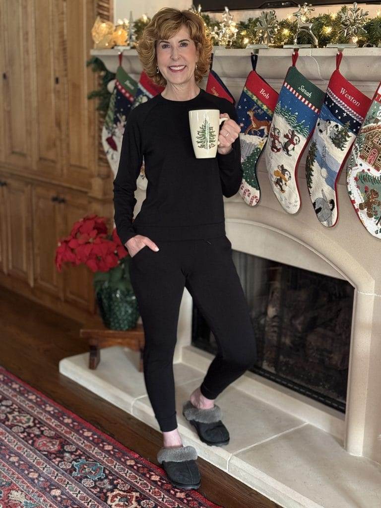 woman standing by fireplace wearing cozy earth bamboo joggers