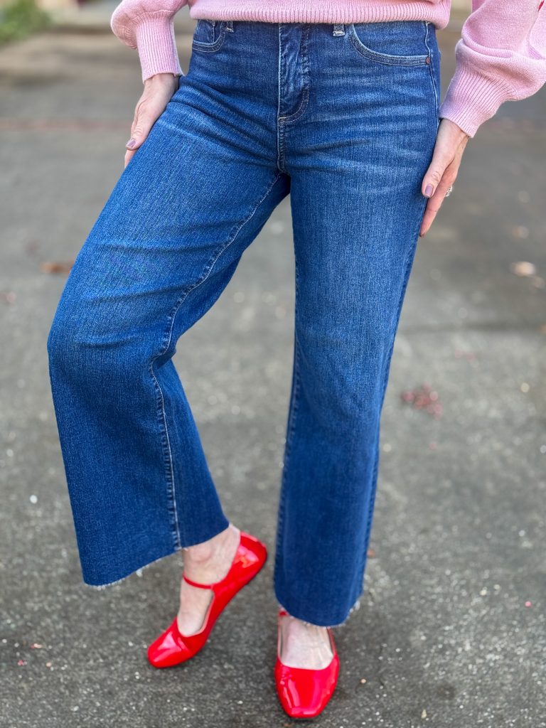 woman wearing jeans and red patent mary janes