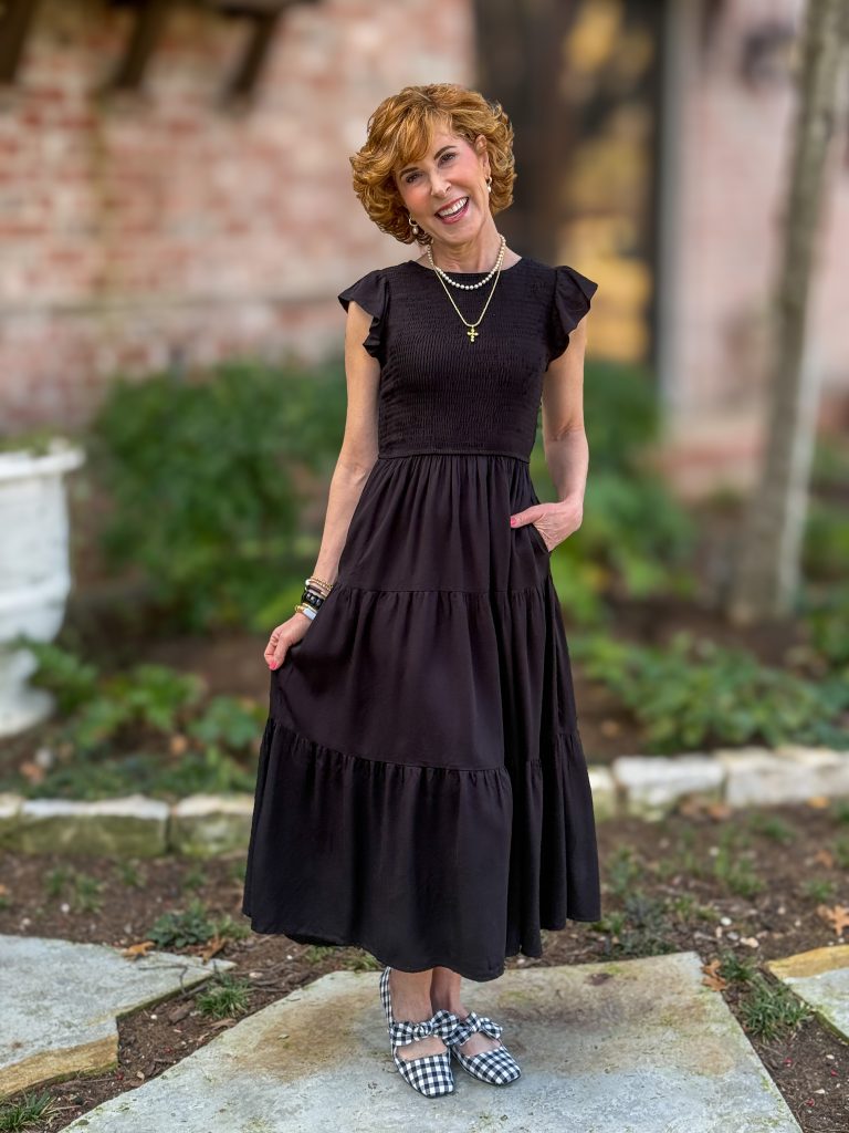 woman wearing black dress with gingham mary janes with bow embellishment