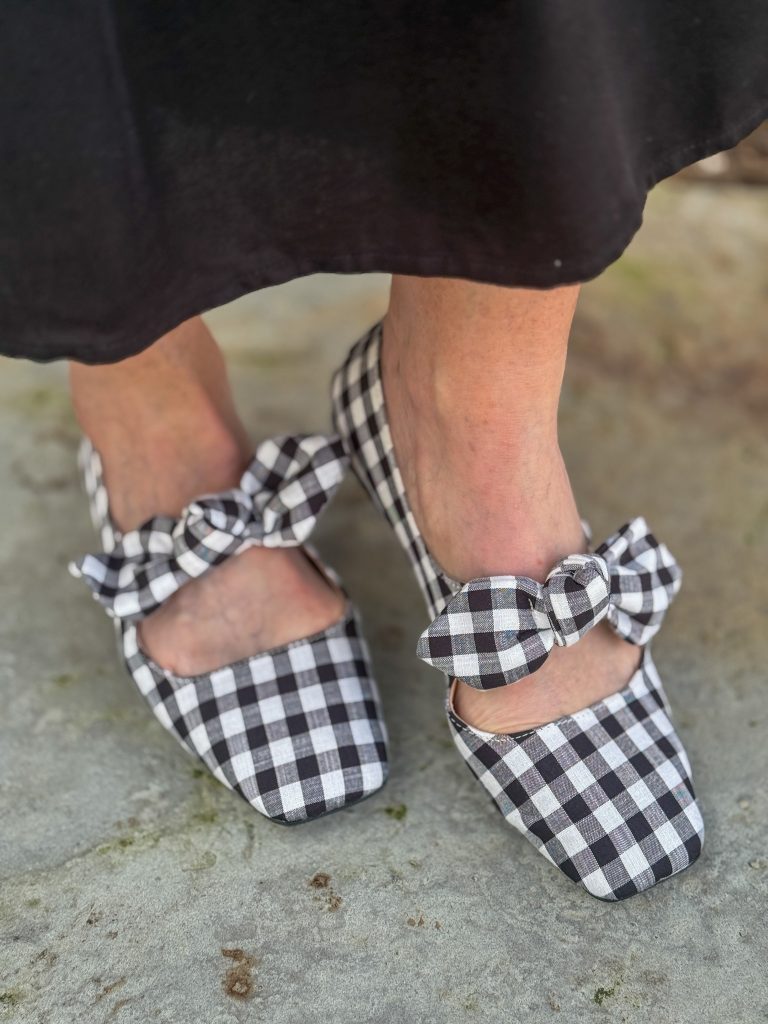 woman wearing gingham mary janes with bow embellishment