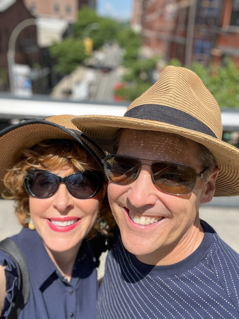 woman and man wearing sun hats