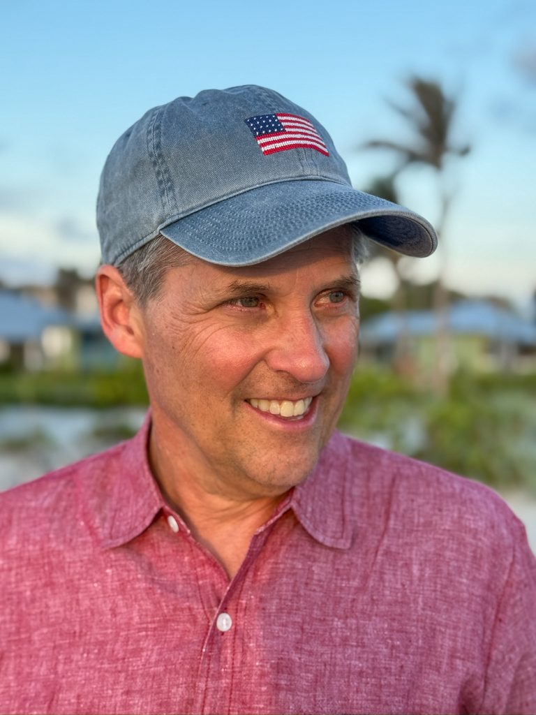 picture of man wearing a denim american flag baseball hat